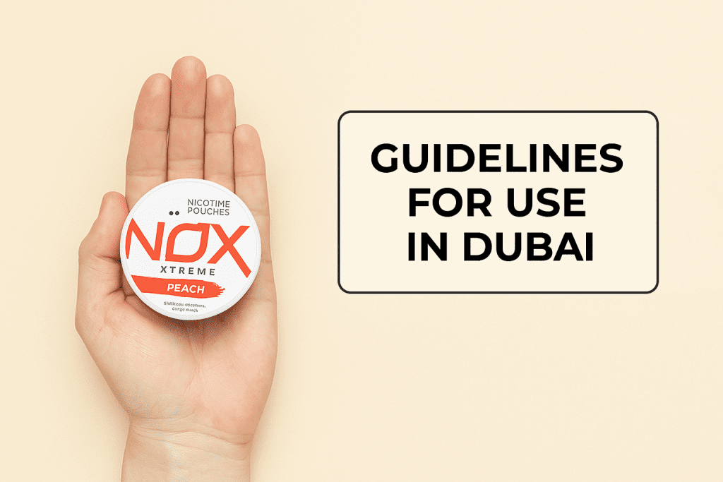 Hand holding NOX nicotine pouch with Dubai usage guidelines sign