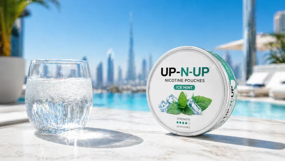 Nicotine pouch tin on sun-drenched surface in Dubai summer heat with mint cooling visual