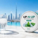 Nicotine pouch tin on sun-drenched surface in Dubai summer heat with mint cooling visual